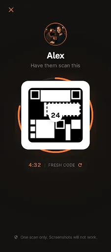 The Scan Me screen: a QR code framed by an ember time ring, ready for someone to scan in person.